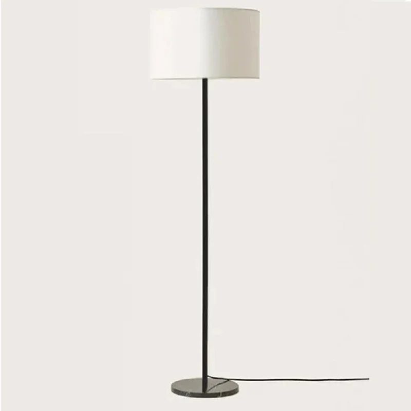 Wood Floor Lamp with Natural Grain for a Warm and Organic FeelHedra Floor Lamp in Matt Black or Matt Brass Wood Floor Lamp with Natural Grain for a Warm and Organic FeelHedra Floor Lamp in Matt Black or Matt Brass
