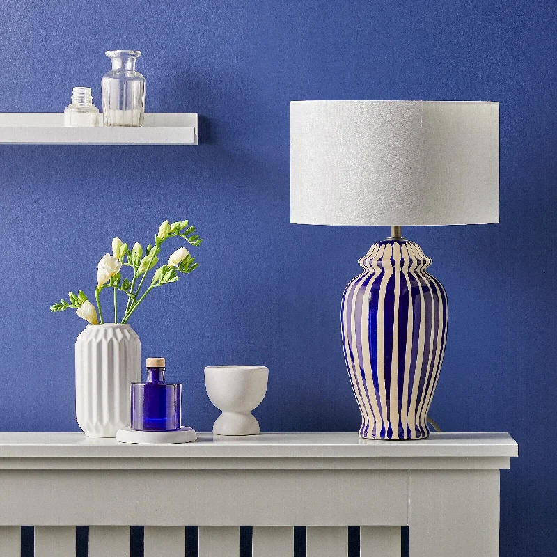 industrial style table lamps with exposed bulbs for loft apartmentsSmaller Lottie bedside lamp in a cobalt blue and stone glaze